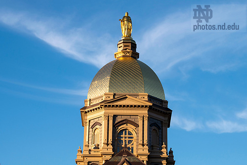 BJ 11.9.23 Golden Dome 9292.JPG by Barbara Johnston/University of Notre Dame November 9, 2023; The statue of Mary atop the Golden Dome at sunset, autumn 2023. (Photo by Barbara Johnston/University of Notre Dame)