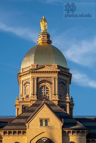 BJ 11.9.23 Golden Dome 9293.JPG by Barbara Johnston/University of Notre Dame November 9, 2023; The statue of Mary atop the Golden Dome at sunset, autumn 2023. (Photo by Barbara Johnston/University of Notre Dame)
