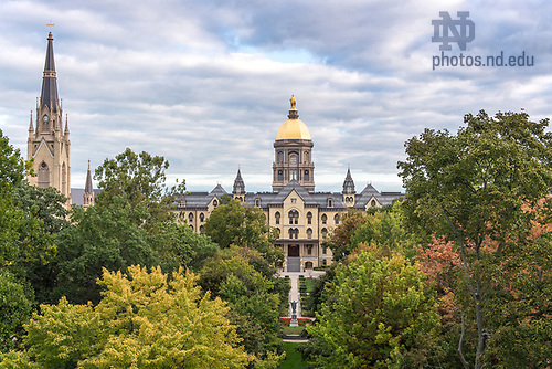 BJ 9.28.17 Main Building 9113.JPG by Barbara Johnston/University of Notre Dame September 28, 2017; Fall foliage over the Main Quad with the Main Building and Basilica of the Sacred Heart bathed in early morning light.  (Photo by Barbara Johnston/University of Notre Dame)