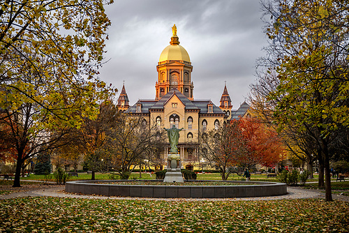 BJ 11.8.23 Main Building Autumn 74.JPG by Barbara Johnston/University of Notre Dame November 8, 2023; The Golden Dome and Statue of Mary atop the Main Building glow at sunset, autumn 2023. (Photo by Barbara Johnston/University of Notre Dame)