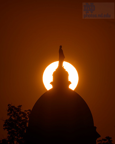 MC 5.23.24 Dome Sunrise.jpg by Matt Cashore/University of Notre Dame May 23, 2024; Sunrise behind the Main Building (Photo by Matt Cashore/University of Notre Dame)