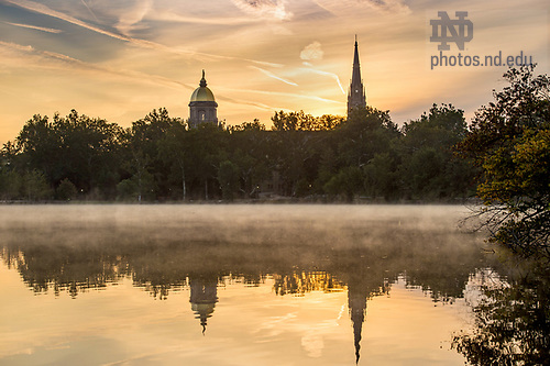 BJ 9.12.17 Campus Sunrise 7459.JPG by Barbara Johnston/University of Notre Dame September 12, 2017; View of sunrise from St. Mary's Lake of the Golden Dome and the steeple of the Basilica of the Sacred Heart.  (Photo by Barbara Johnston/University of Notre Dame)